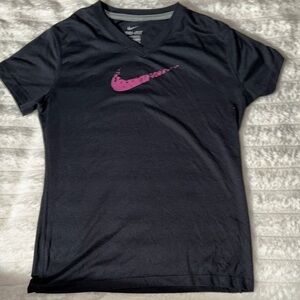 black nike shirt with pink swoosh